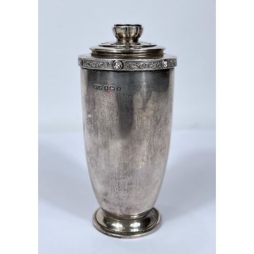 608 - A hallmarked silver sugar dredger of tapering form with Celtic rim, Birmingham 1926, 5oz