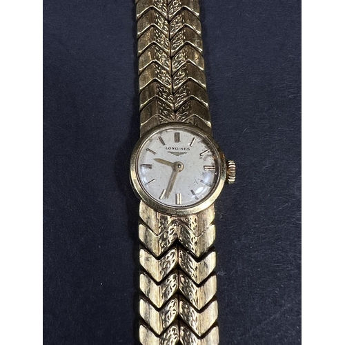 614 - A Longines lady's wristwatch on 18 carat double chevron strap, gross weight 35.5gm