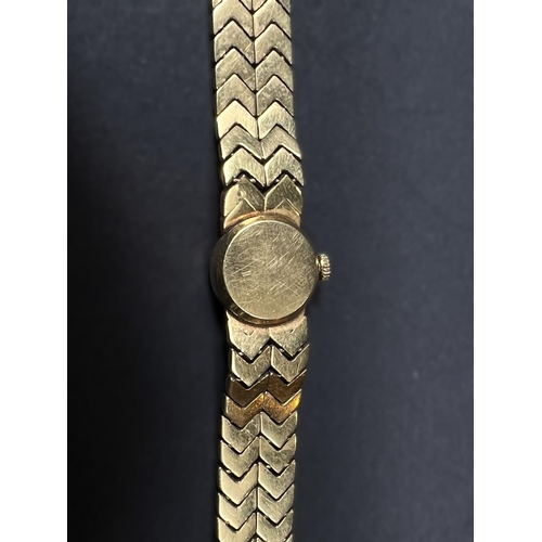 614 - A Longines lady's wristwatch on 18 carat double chevron strap, gross weight 35.5gm