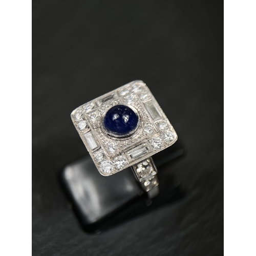 640 - A sapphire and diamond Art Deco cocktail ring with central cabochon sapphire surrounded by 16 brilli... 