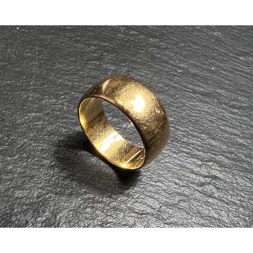 675 - A 22ct hallmarked gold 'D' shaped wedding ring size G, 5.8gms