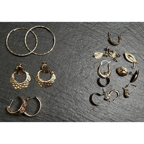 683 - Three pairs of yellow metal earrings all testing as 9ct, 4.9gm gross; other odd yellow metal earring... 