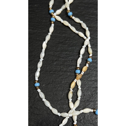 689 - A coral and freshwater pearl necklace with yellow metal clasp; a similar 3 strand necklace with turq... 