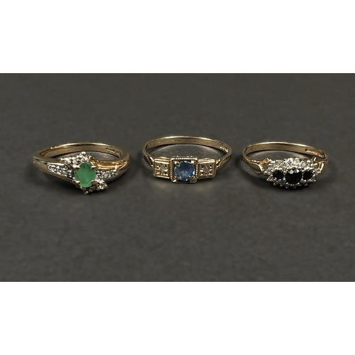 691 - Three 9ct gold rings, 1 set oval emerald colour stone, 1 set round sapphire, the other with 3 small ... 