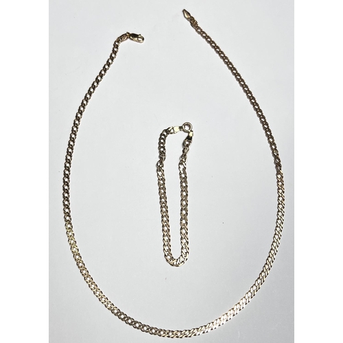 693 - A 9ct hallmarked flat curb chain necklace, length 45cm and a similar style bracelet, 10.2gm gross