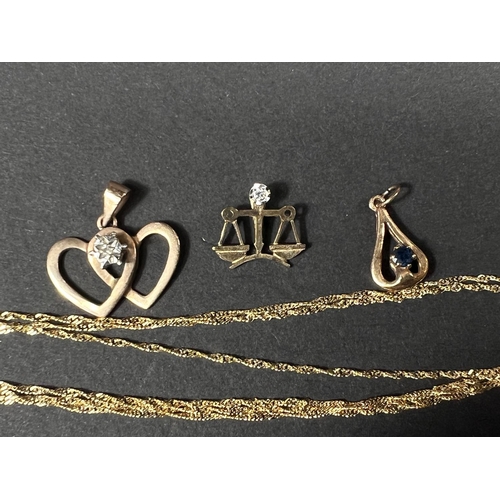 696 - A 9ct hallmarked gold fine triple strand necklace; 2 gold small pendants, one set diamond chip, the ... 