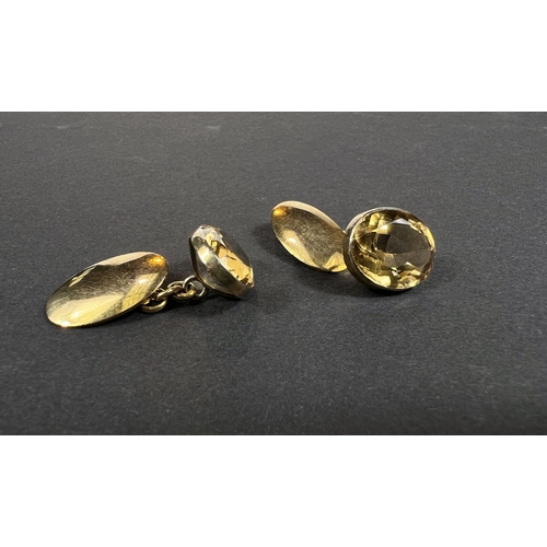 706 - A pair of 9ct gold cufflinks set oval faceted citrines, 8.72gm gross