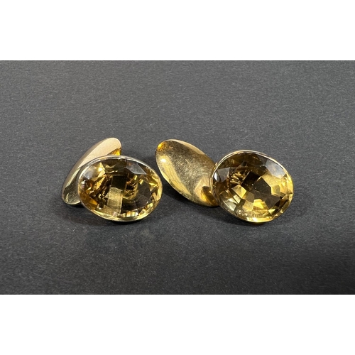 706 - A pair of 9ct gold cufflinks set oval faceted citrines, 8.72gm gross