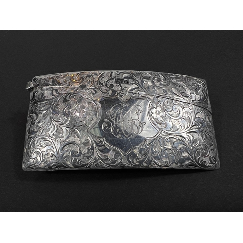 708 - A card case, Edwardian silver, of curved rectangular form with floreate chasing, Birmingham, 1909