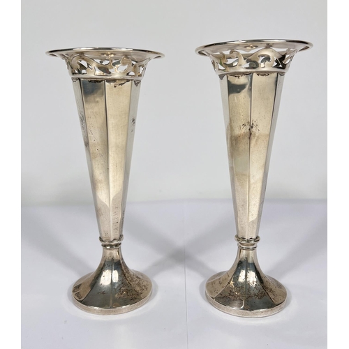 718 - A hallmarked silver pair of specimen vases of tapering pierced form, on weighted bases, Birmingham 1... 