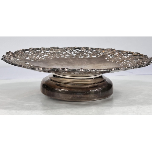 603 - A hallmarked silver shallow pedestal dish with floral pierced border, on circular foot, Sheffield 19... 