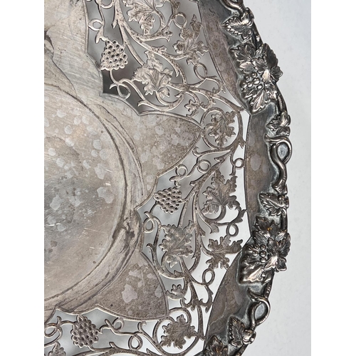 605 - A hallmarked silver shallow dish with relief and pierced vine decoration, on circular foot, Sheffiel... 