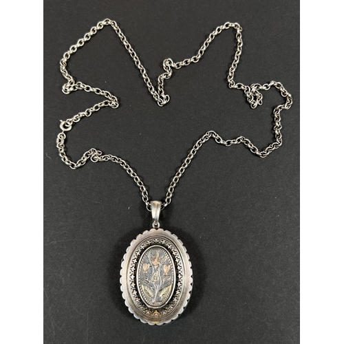 645 - An Edwardian silver locket, gold colour inlay with later silver chain, 26gm