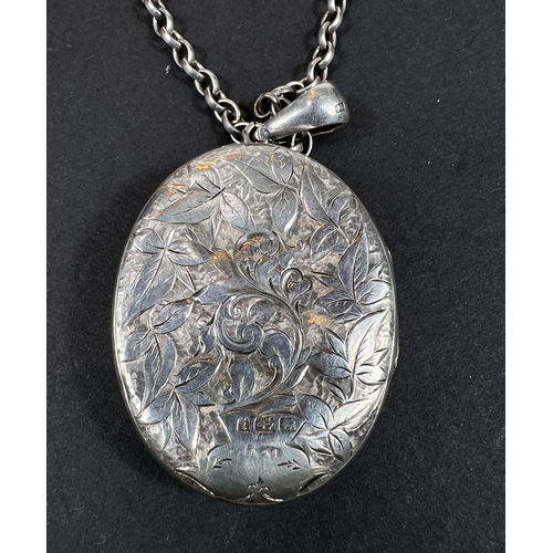 645 - An Edwardian silver locket, gold colour inlay with later silver chain, 26gm