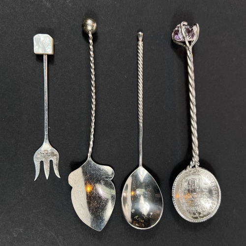 710 - A Russian silver spoon, a coin spoon and 2 others, 71gm gross