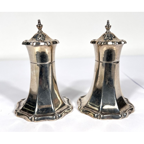 713 - A pair of ornate silver pepper pots and matching mustard pot (liner a/f), Birmingham, 1938, 5oz