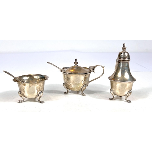 720 - A hallmarked silver cruet:  mustard, salt and pepper, with spoons, Birmingham 1944, 3oz