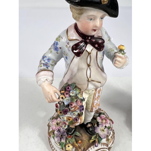 518 - A pair of 19th century Meissen style figures of children in 18th century dress gathering flowers wit... 