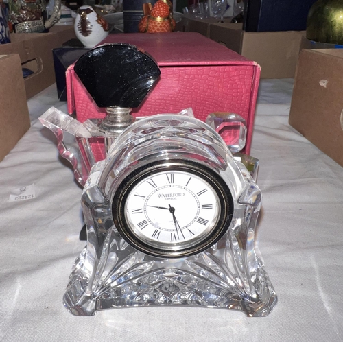 528 - A Waterford Crystal mantelclock;2 Art Deco glass scent bottles; a large crystal scent bottle, boxed