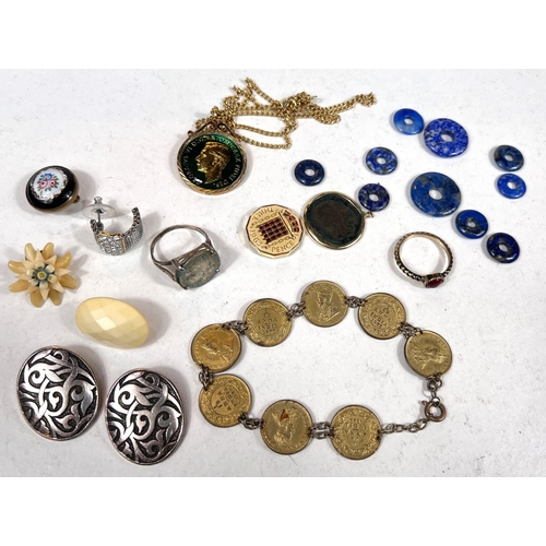 647 - A Roman coin in yellow metal mount, other similar items; A collection of Lapis Lazuli circles, other... 