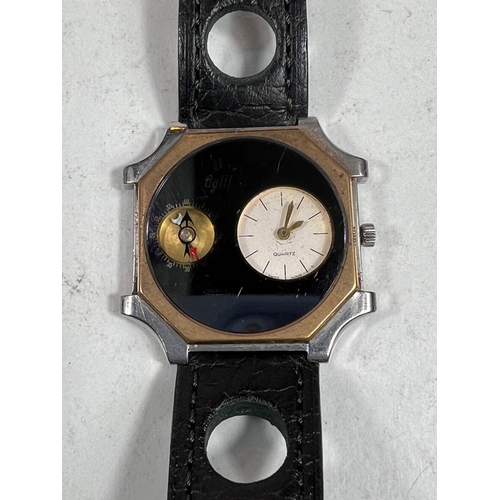 725 - A DALIL middle eastern gents quartz movement wristwatch with COMPASS