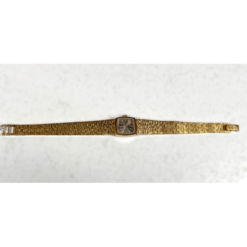 729 - An OMEGA 1970's ladies cocktail watch, gilt bark effect strap