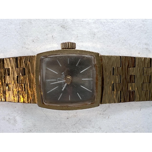 729 - An OMEGA 1970's ladies cocktail watch, gilt bark effect strap