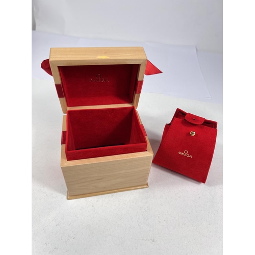 737 - An OMEGA presentation box in polished wood with red plush lining, c. 2000