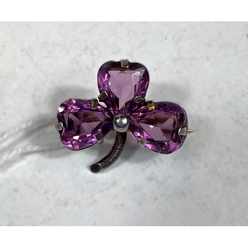 740 - CHARLES HORNER, a silver and amethyst trefoil brooch, 1905