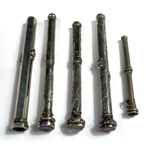 173 - Five silver/white metal propelling pencils, four with stones to top, some hallmarks worn