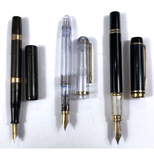 185 - A Watermans vintage fountain pen with 9ct gold bands, another Watermans and another