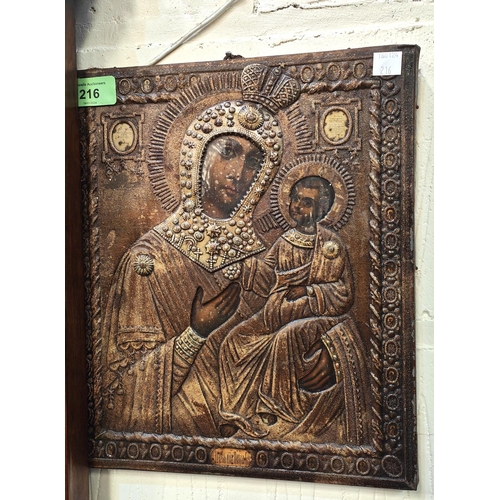 216 - A Russian orthodox metal framed picture of Mary and Jesus on wooden backing