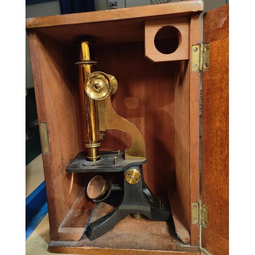 269 - A 19th century monocular microscope by C W Dixey & Son, London with mahogany box and lenses