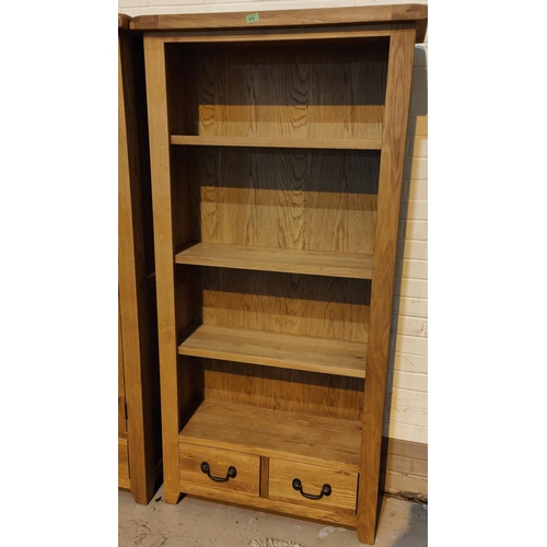 875 - A modern light oak full height bookcase with 4 shelves and 2 small drawers