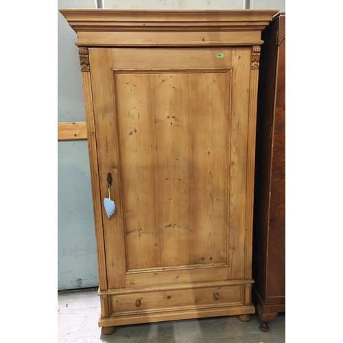 905 - A Victorian stripped pine single door wardrobe with panelled and beaded door, drawer below, ht. 188 ... 