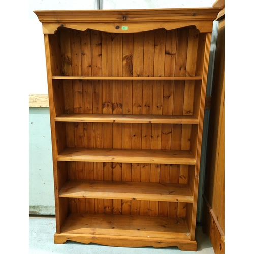 911 - A large pine bookcase, 5 height, ht. 186cm x width 124cm