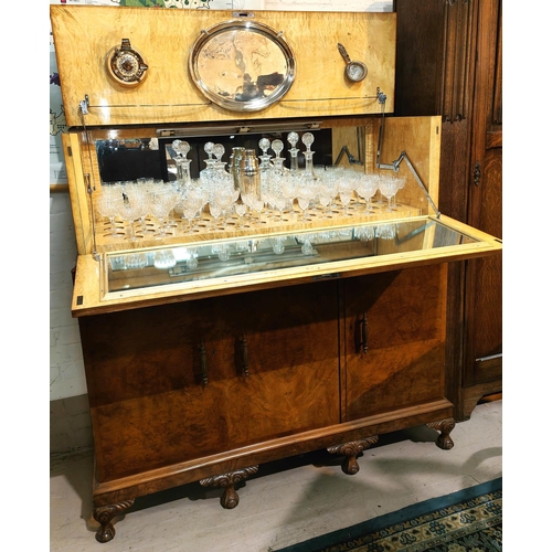 934 - A large Art Deco burr walnut drinks cabinet with fall front, fitted interior with glassware 3 drawer... 