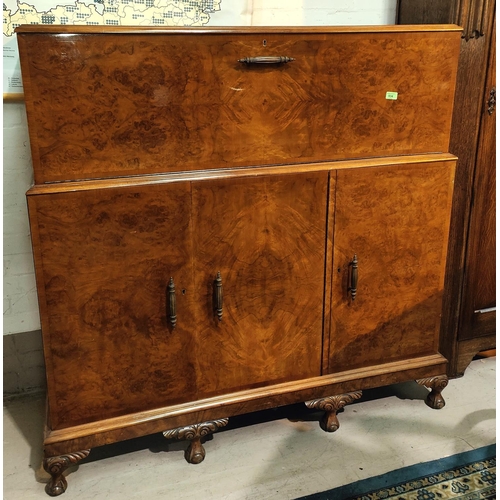 934 - A large Art Deco burr walnut drinks cabinet with fall front, fitted interior with glassware 3 drawer... 