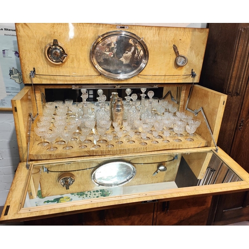 934 - A large Art Deco burr walnut drinks cabinet with fall front, fitted interior with glassware 3 drawer... 