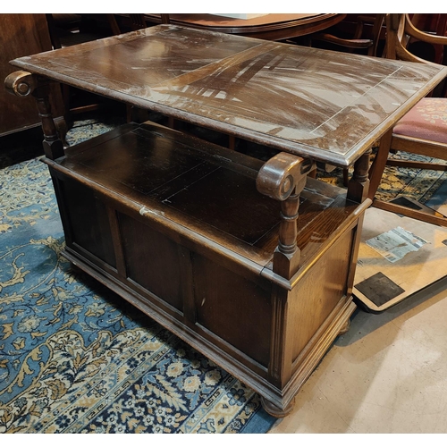 935 - A 1930's oak monks bench with linen fold decoration