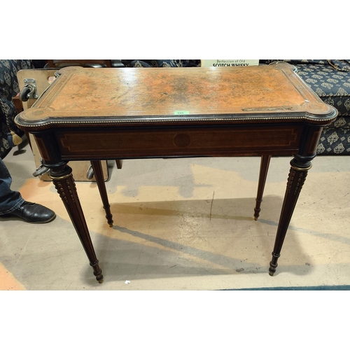 945 - A late 19th/early 20th century mahogany card table in the Louis XVI style, the fold over top with or... 