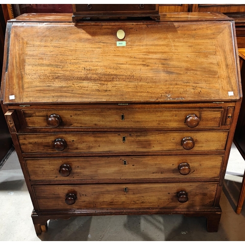 968 - A Georgian mahogany fall front bureau with tall front, fitted interior, 4 long graduating drawers wi... 