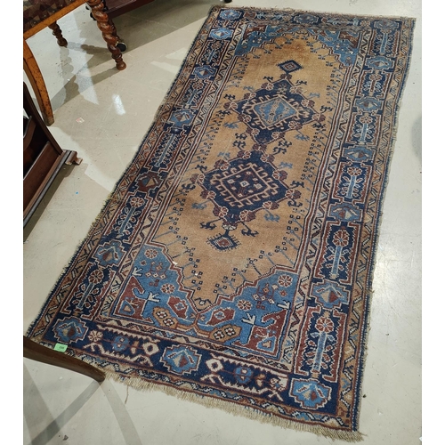 980 - A blue ground Middle Eastern rug, worn, 180 x 102cm