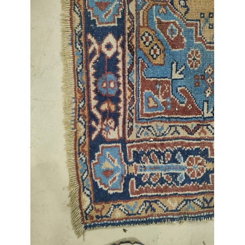 980 - A blue ground Middle Eastern rug, worn, 180 x 102cm