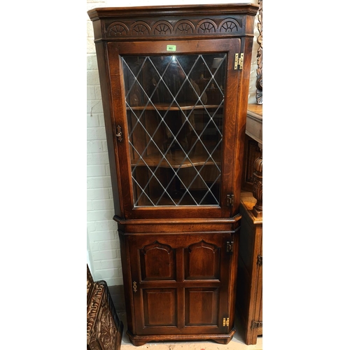 993 - A Titchmarsh & Goodwin period style distressed oak full height corner cupboard with leaded glass... 