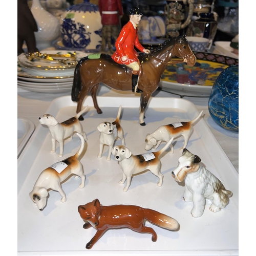 534 - A Beswick hunting group:  mounted huntsman, 5 hounds, fox, etc.