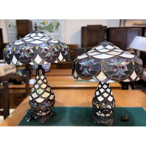 540 - A large pair of Tiffany style table lamps with leaded and coloured mushroom shades and baluster bodi... 