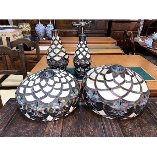 540 - A large pair of Tiffany style table lamps with leaded and coloured mushroom shades and baluster bodi... 