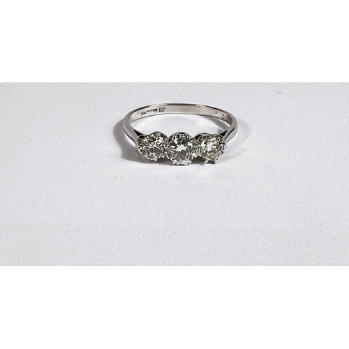 702 - A 3 stone diamond ring set in 18ct gold/platinum, approx. 0.75 carat