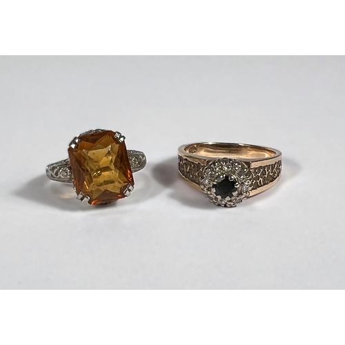 794C - A white metal dress ring set with orange stone, stamped 14k DB and a 9ct gold dress ring